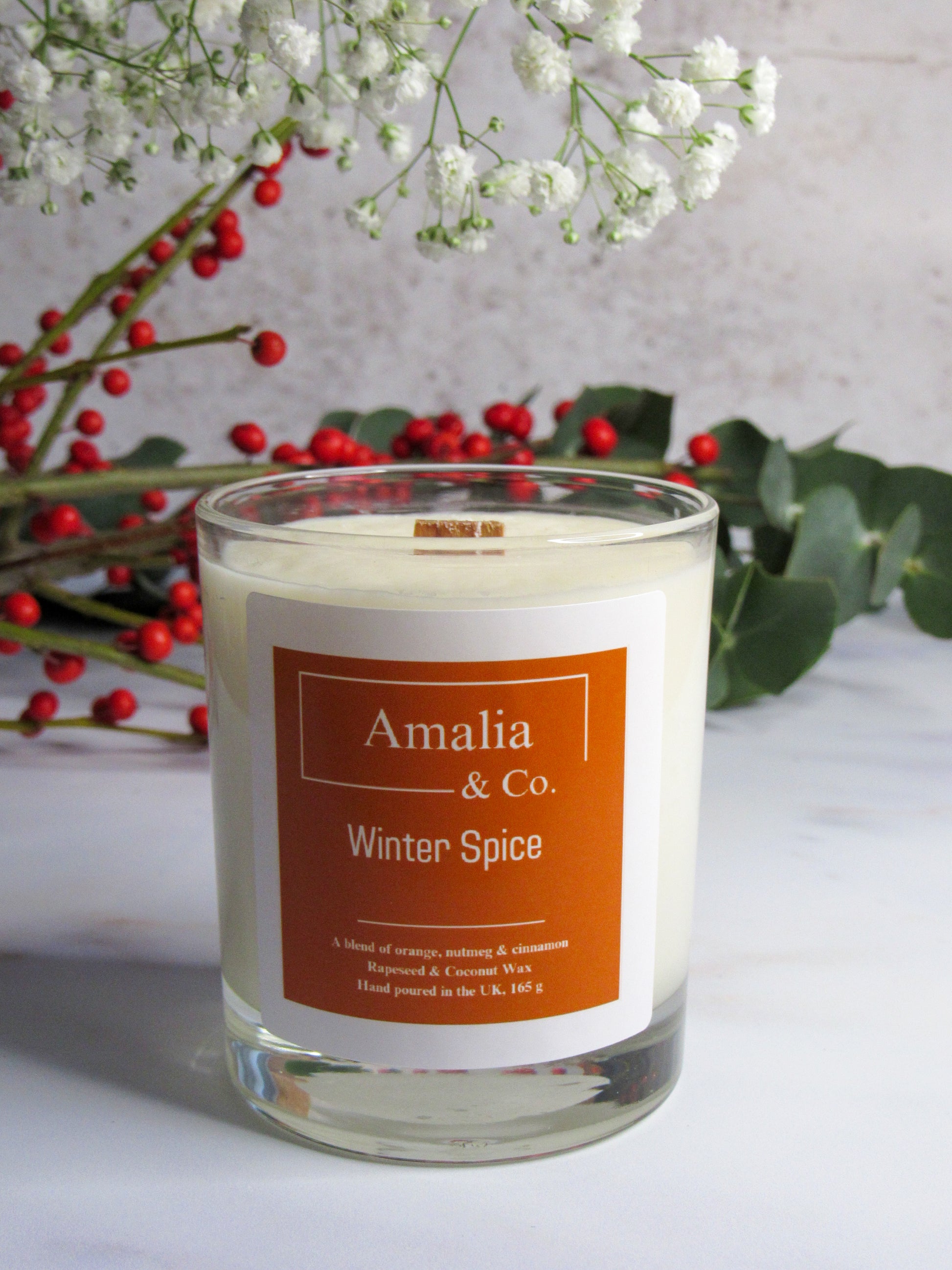 Winter Spice luxury candle with notes of cinnamon, clove, orange, and warm spices, perfect for creating a cozy atmosphere during the colder months